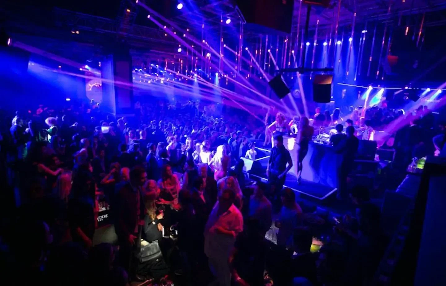 Energetic dance floor at 1 Oak nightclub in Los Angeles with colorful lights and crowd