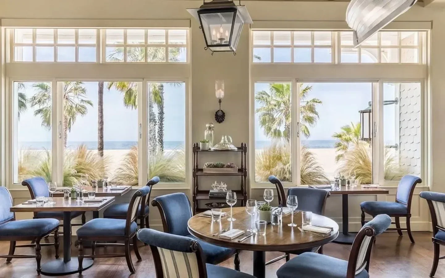 Coastal view from 1 Pico restaurant in Los Angeles, featuring elegant dining tables.