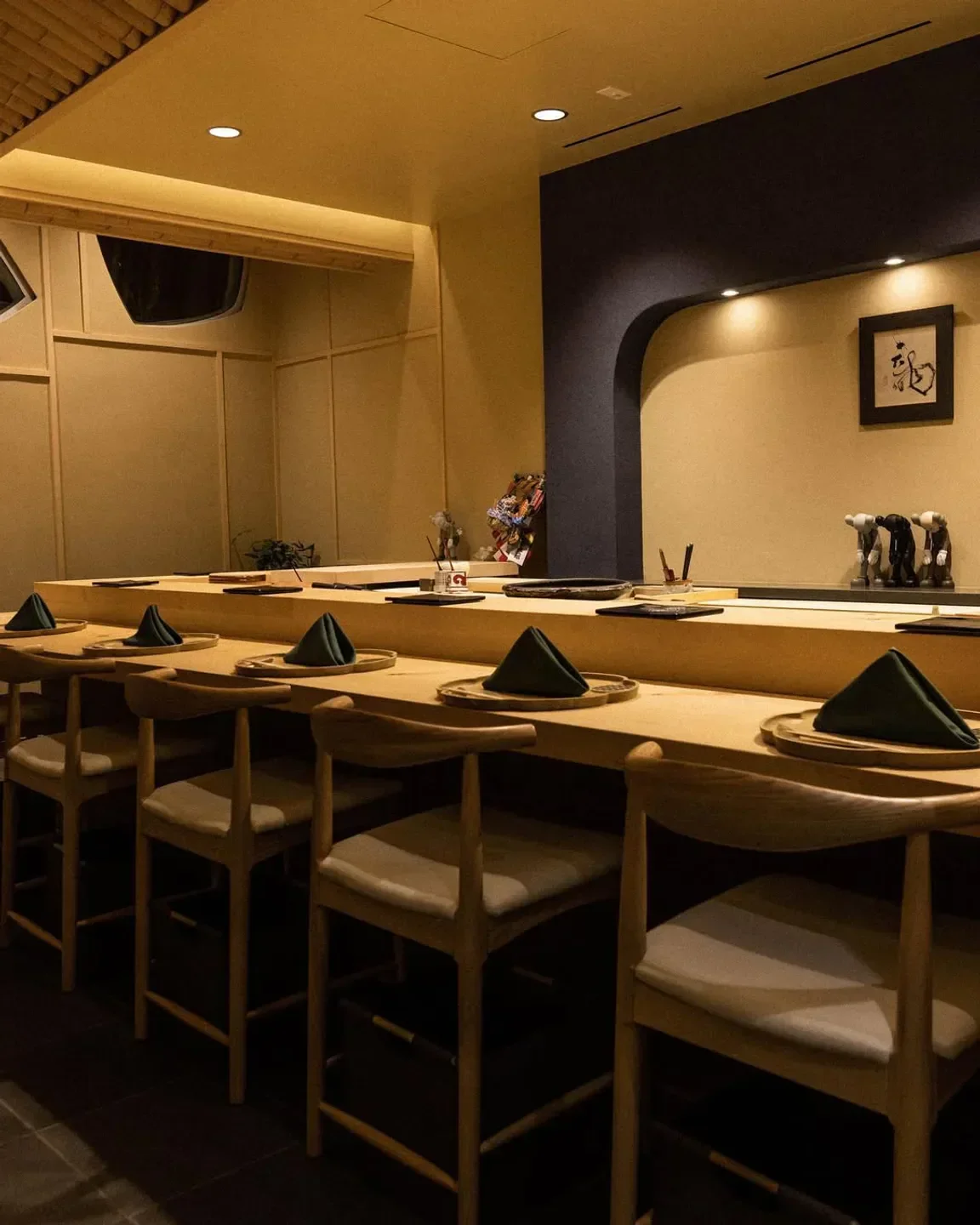 Interior dining at 715 restaurant in Los Angeles, featuring stylish seating and table setting.