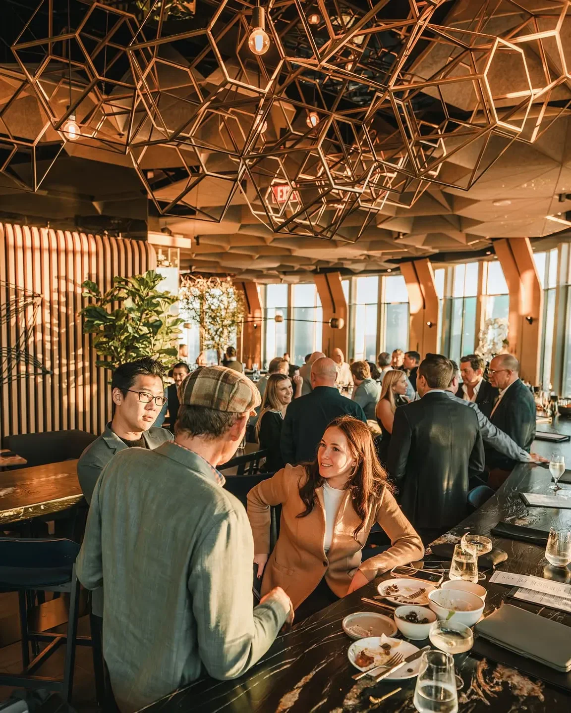 Dining at 71Above restaurant in Los Angeles with stunning geometric ceiling design.