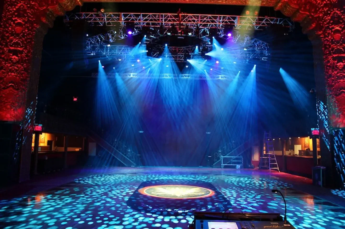 Interior of the Belasco Theatre in Los Angeles, lit with stage lights and dance floor effects