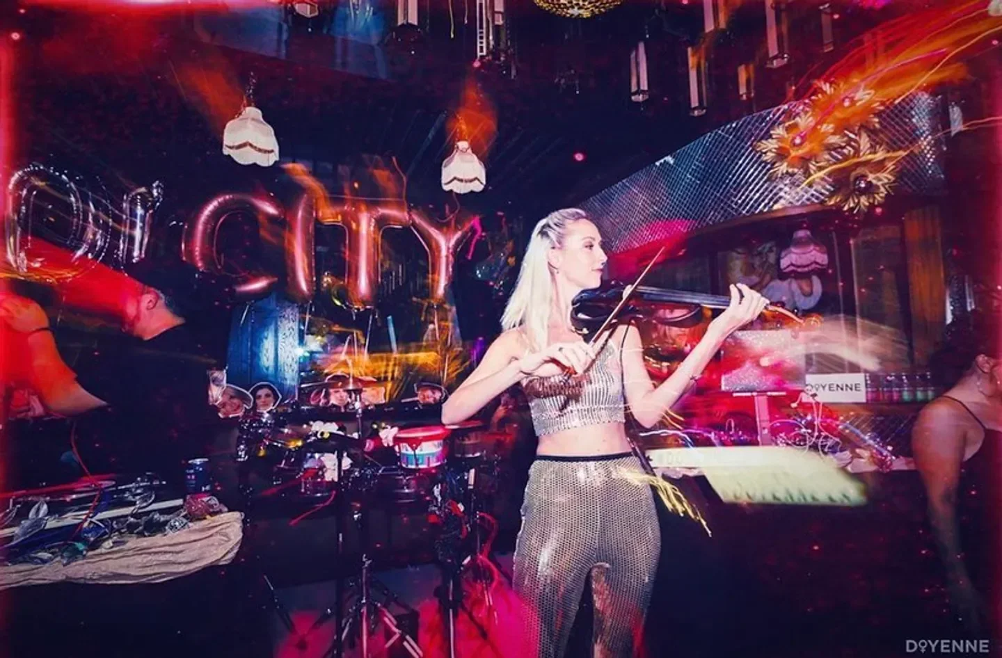 Live music at Blind Dragon Los Angeles with a violinist in a sparkling outfit