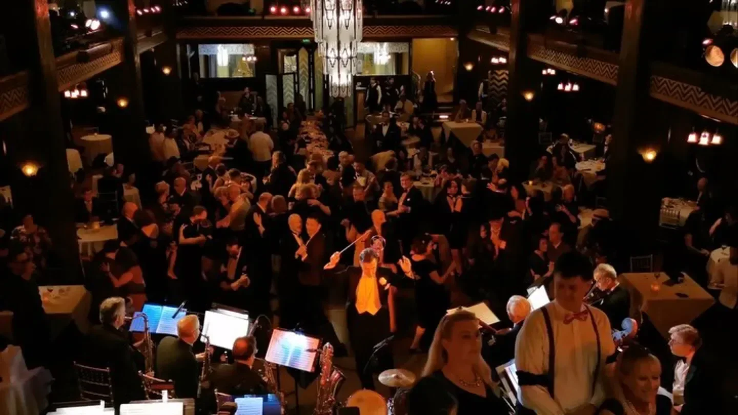 Cicada restaurant in Los Angeles with a live band, filled with guests enjoying the night.