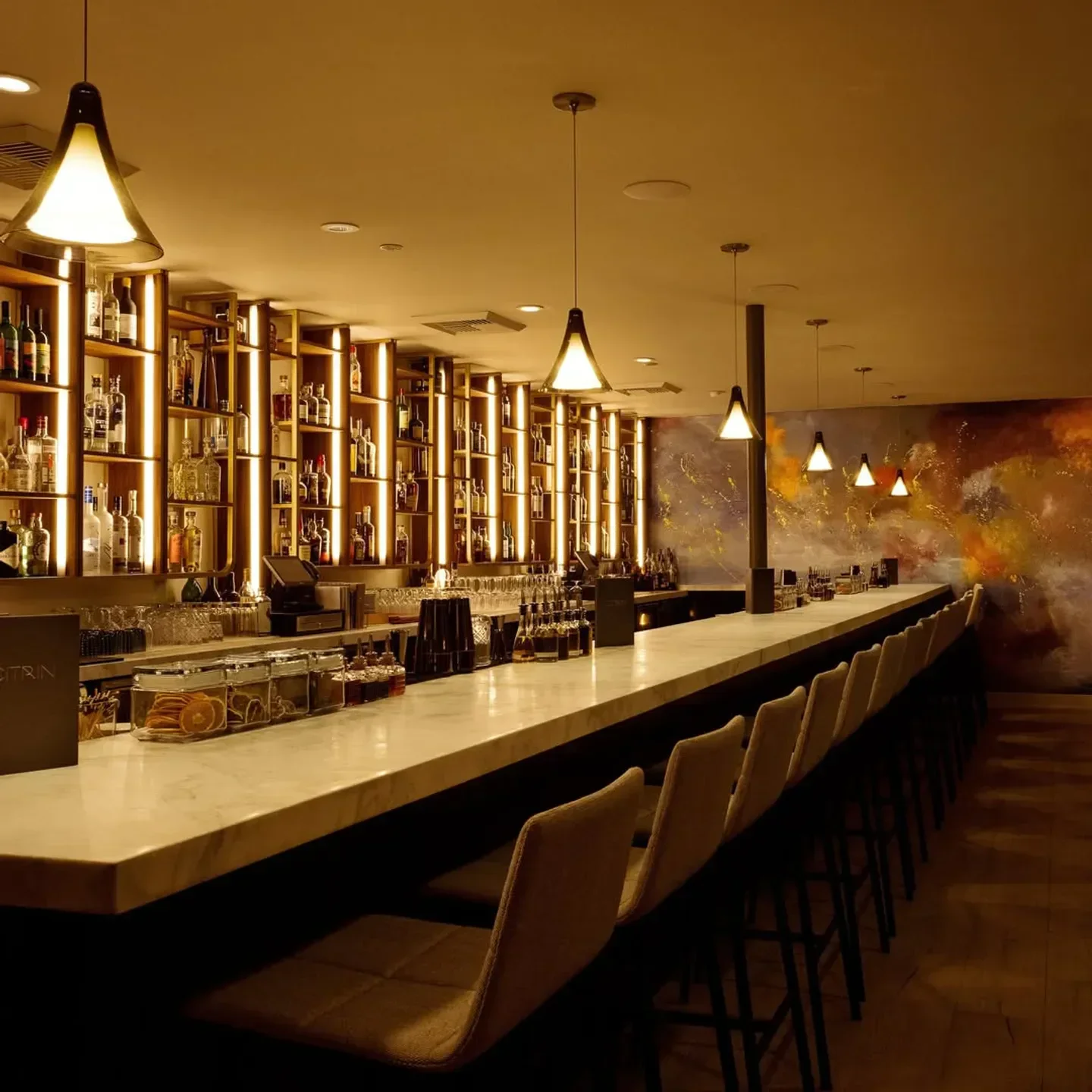 Interior of Citrin restaurant in Los Angeles with bar and stylish lighting.