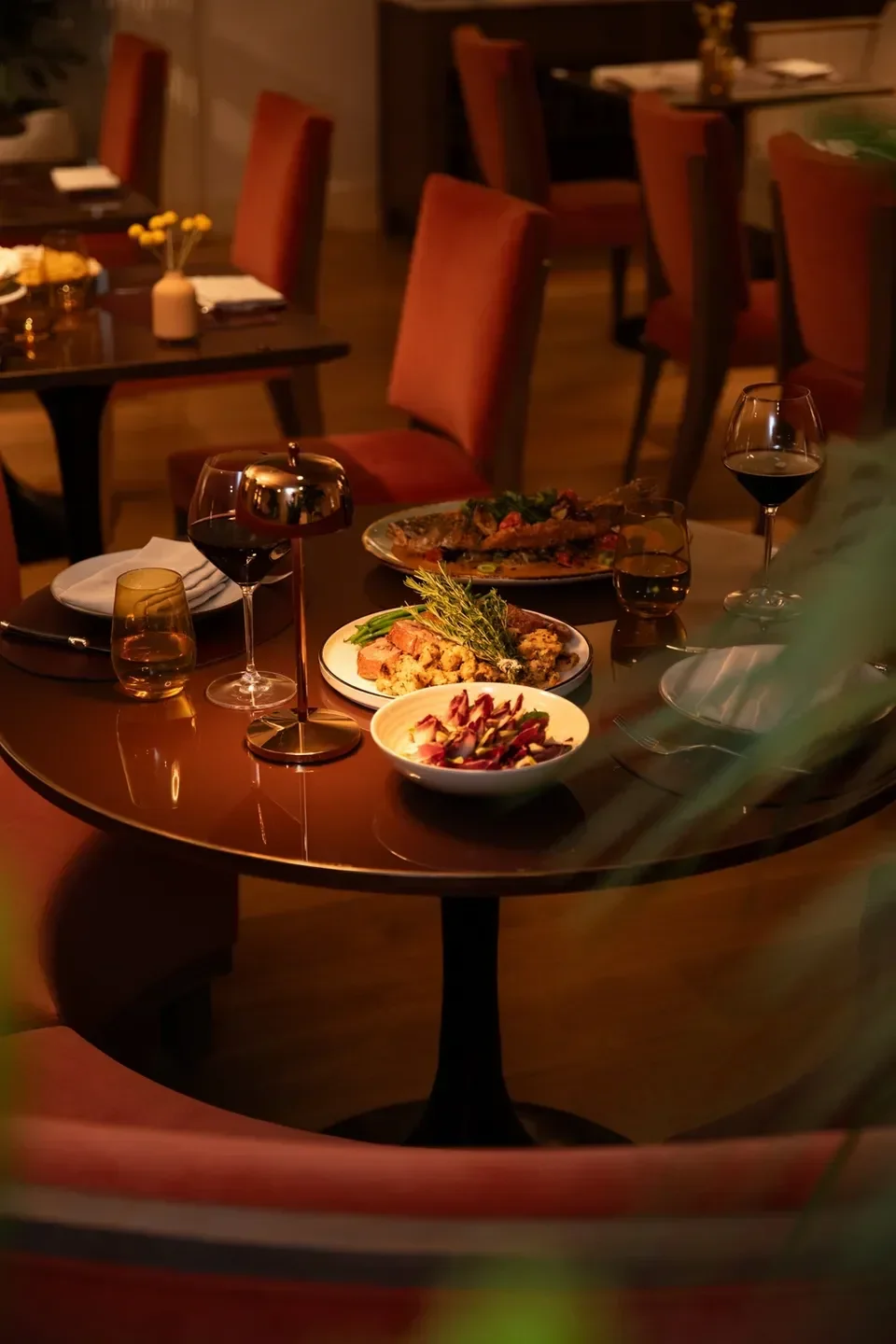 Table setting with food and drinks at Costa Cova restaurant in Los Angeles.