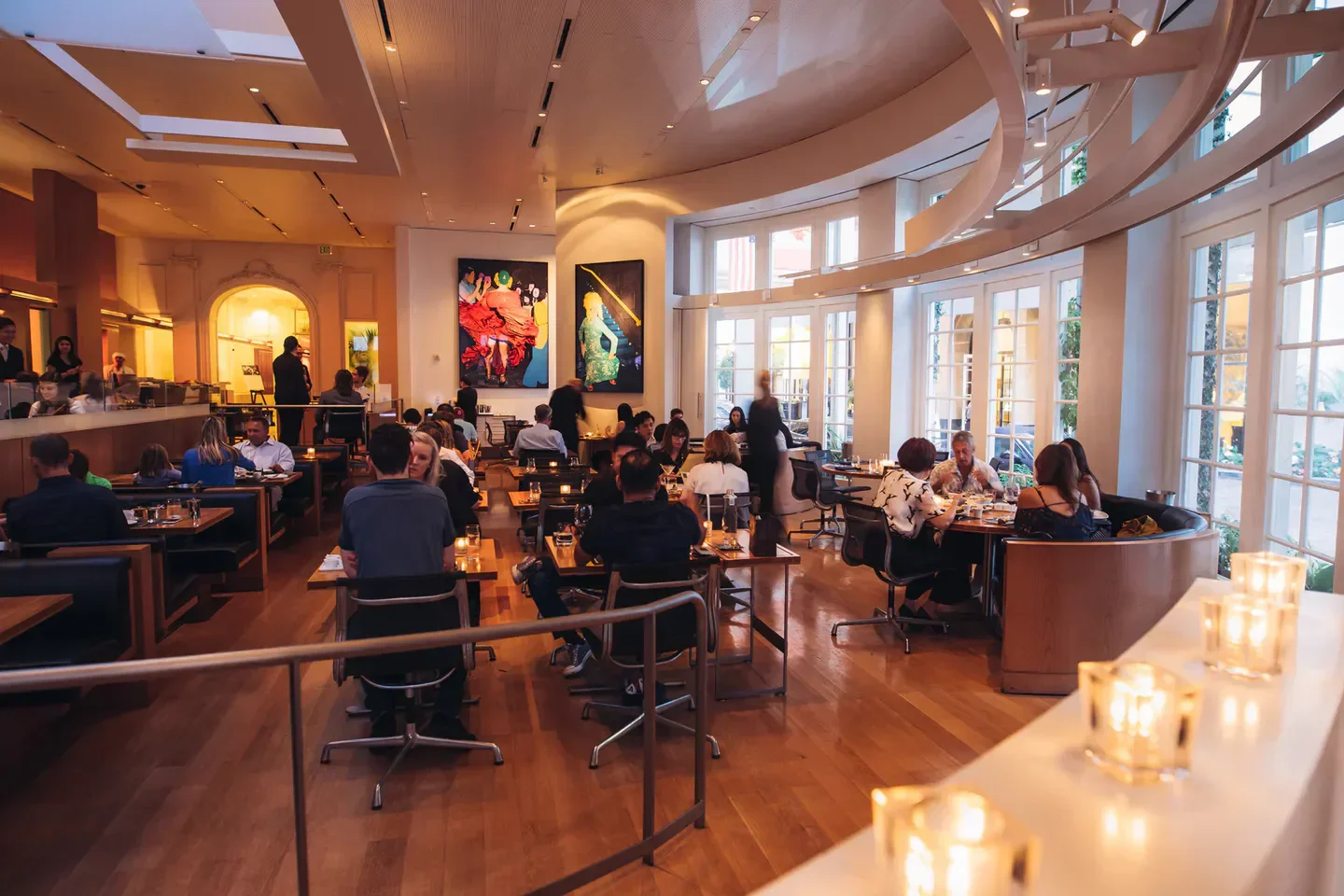 Elegant dining room at CUT Beverly Hills restaurant in Los Angeles with customers.