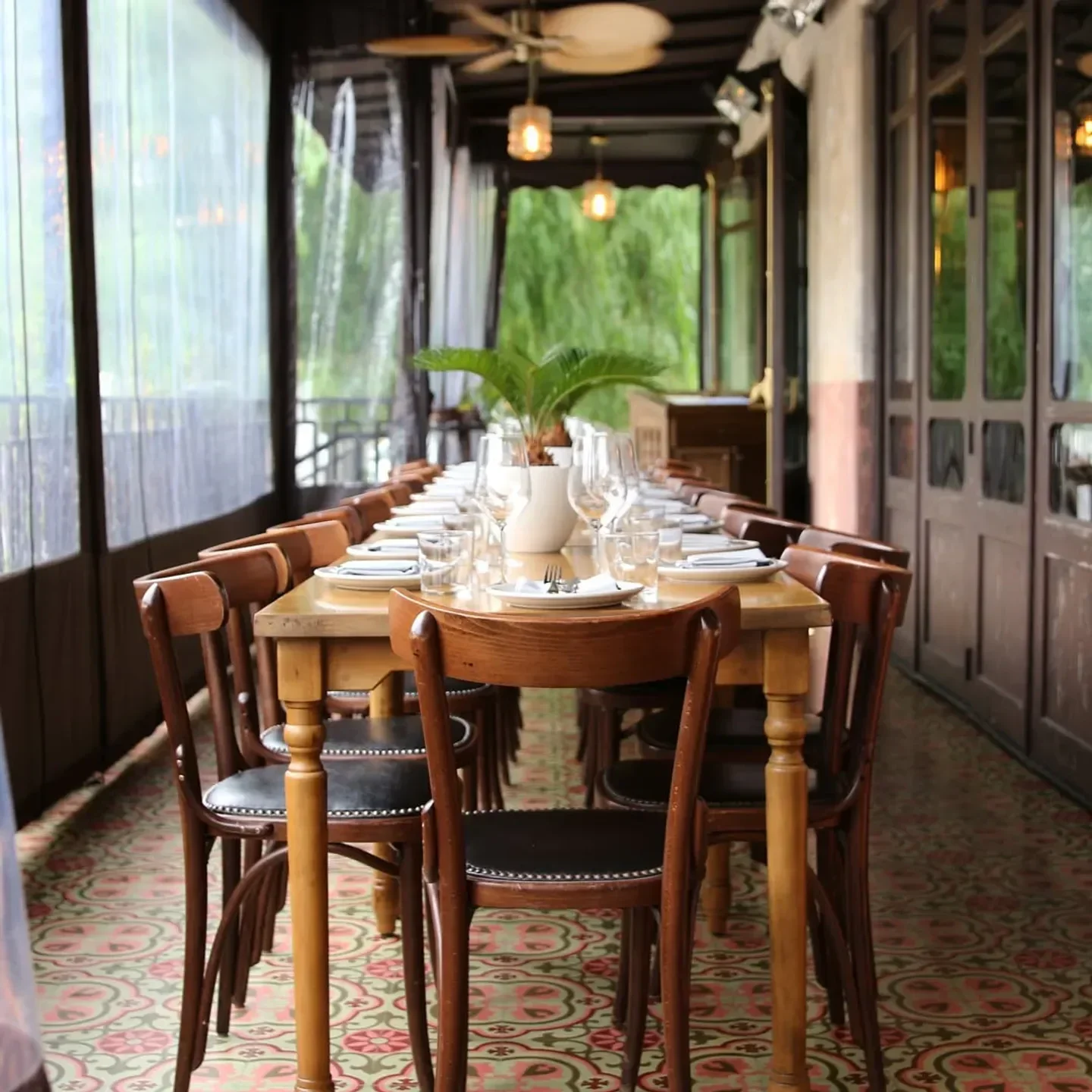 Dining setup at DAMA Fashion District Restaurant & Bar in Los Angeles with classic chairs.