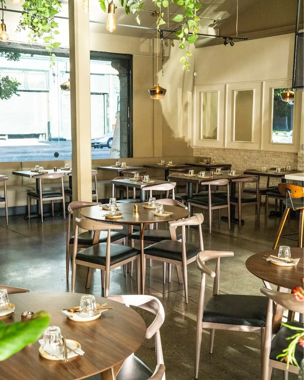 Interior dining at Danbi restaurant in Los Angeles, showing tables and chairs.