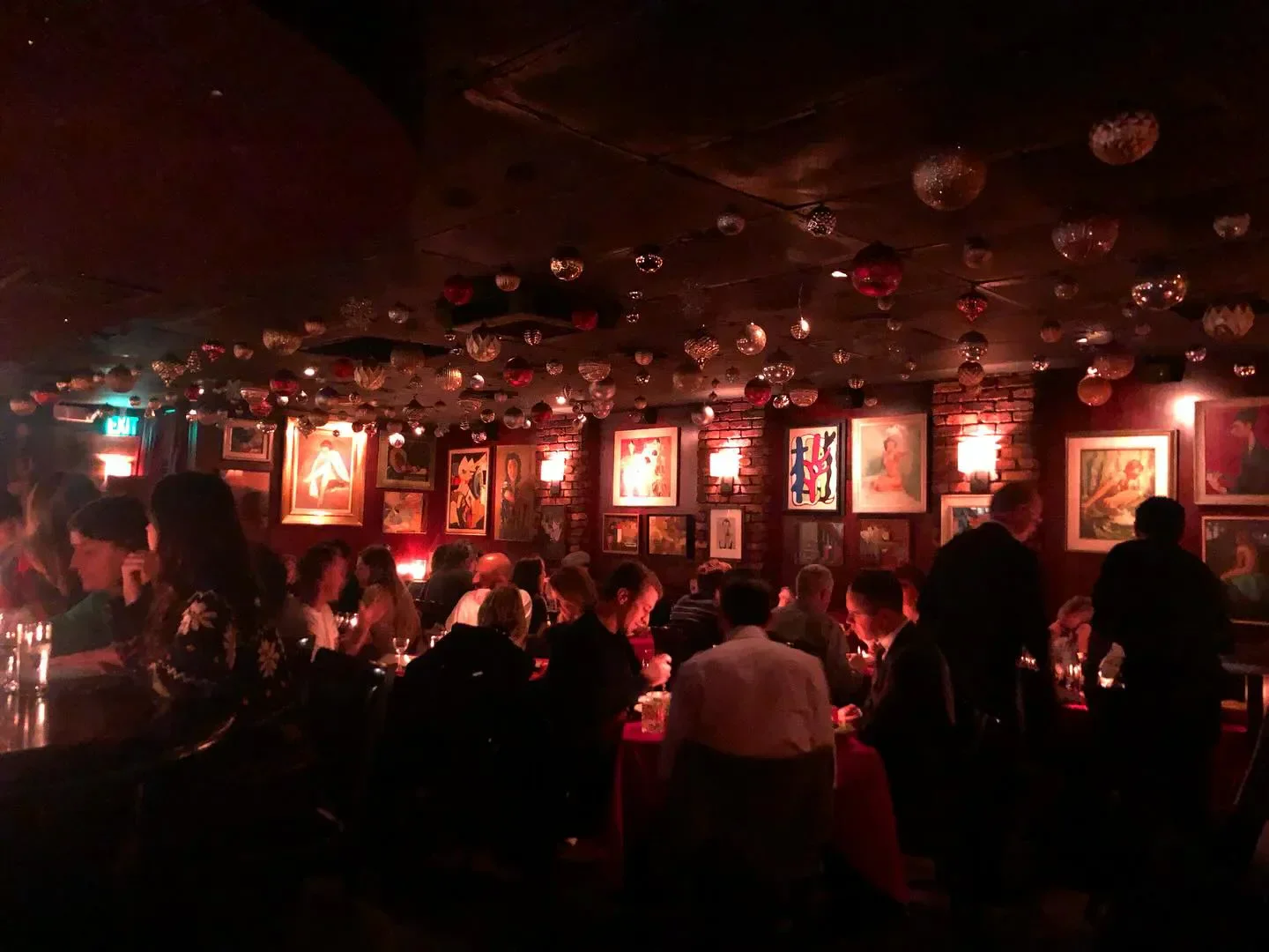 Cozy dining room at Dear John's in Los Angeles, featuring art and ambiance.