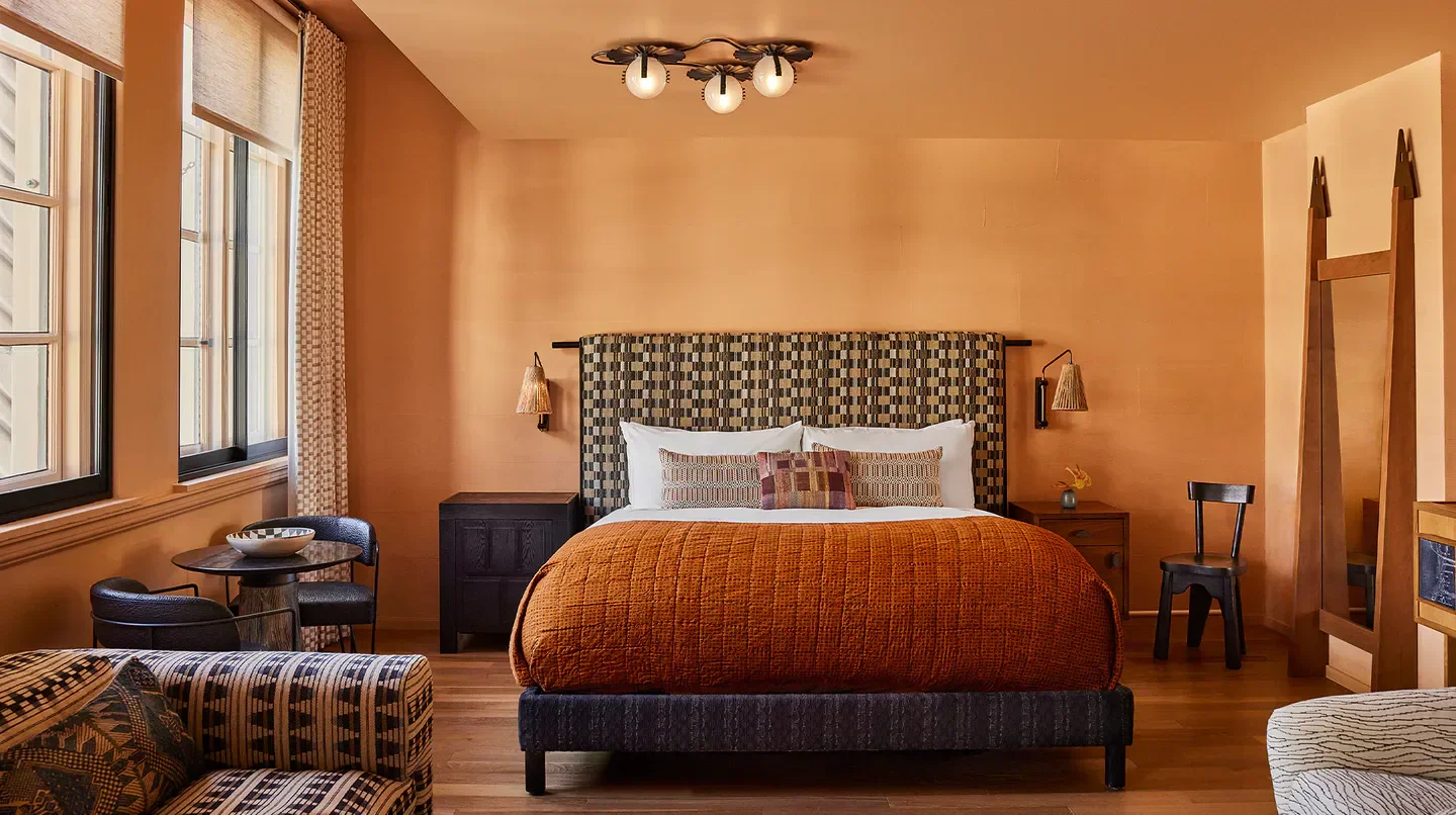 Cozy bedroom interior at Downtown L.A. Proper Hotel in Los Angeles, California.
