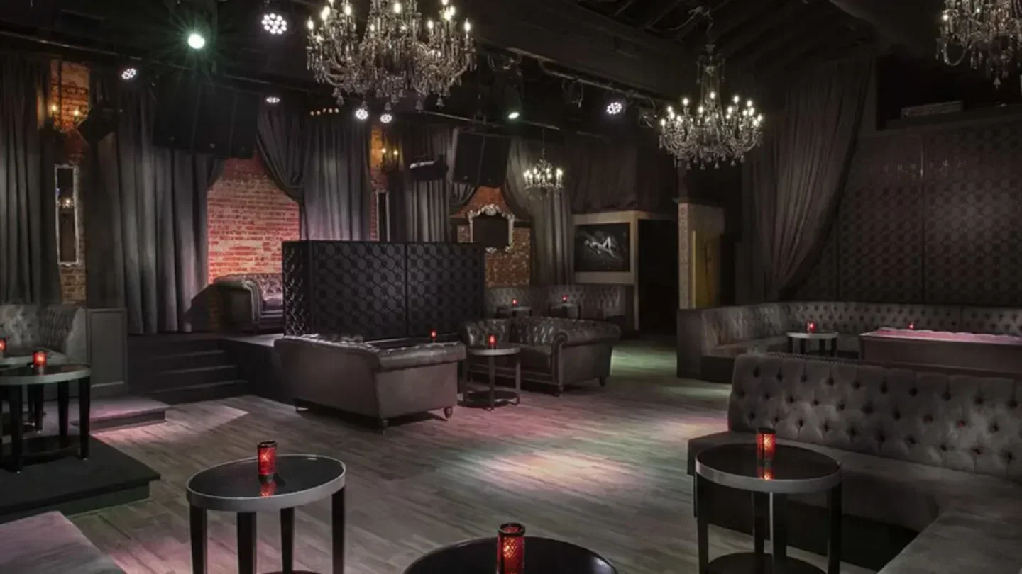 Interior of Dragonfly nightclub in Los Angeles with chandeliers and stylish seating