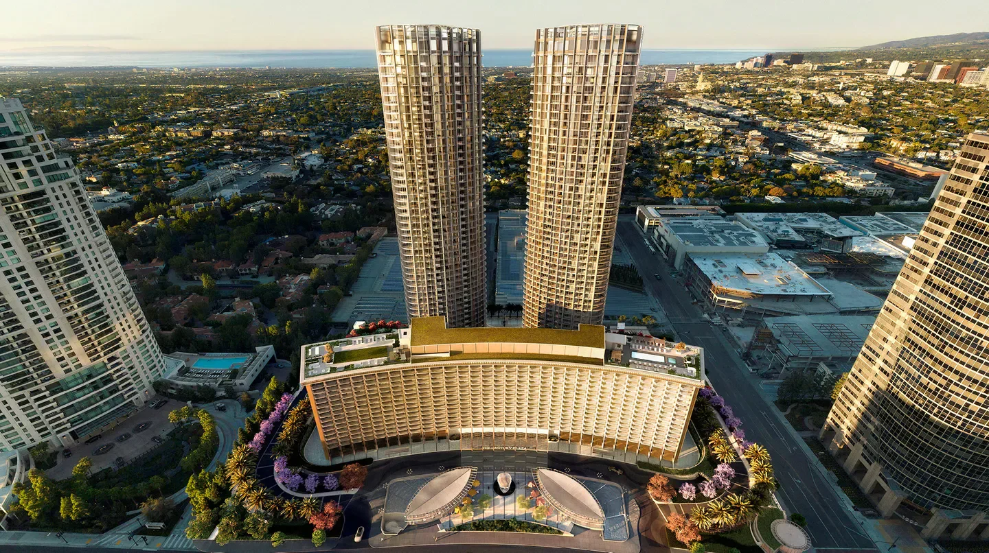Aerial view of Fairmont Century Plaza hotel and Los Angeles cityscape.