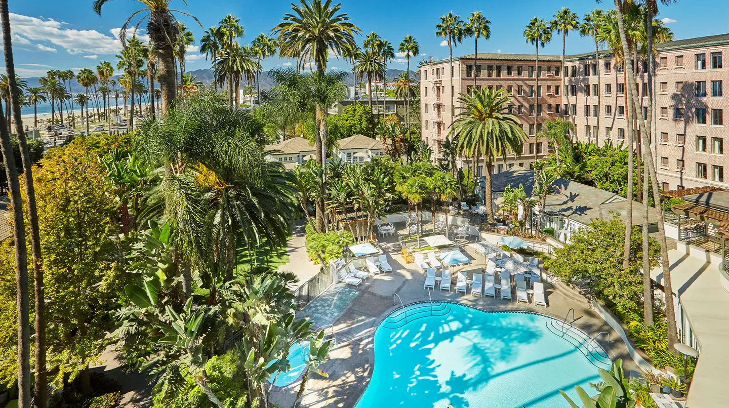 Pool and tropical gardens at Fairmont Miramar Hotel & Bungalows in Los Angeles.