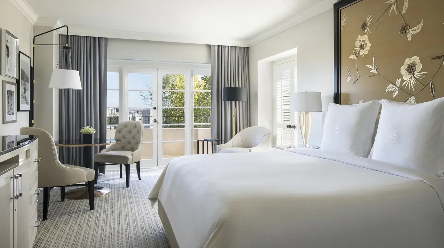 Elegant bedroom at Four Seasons Hotel Los Angeles at Beverly Hills, Los Angeles with balcony view.