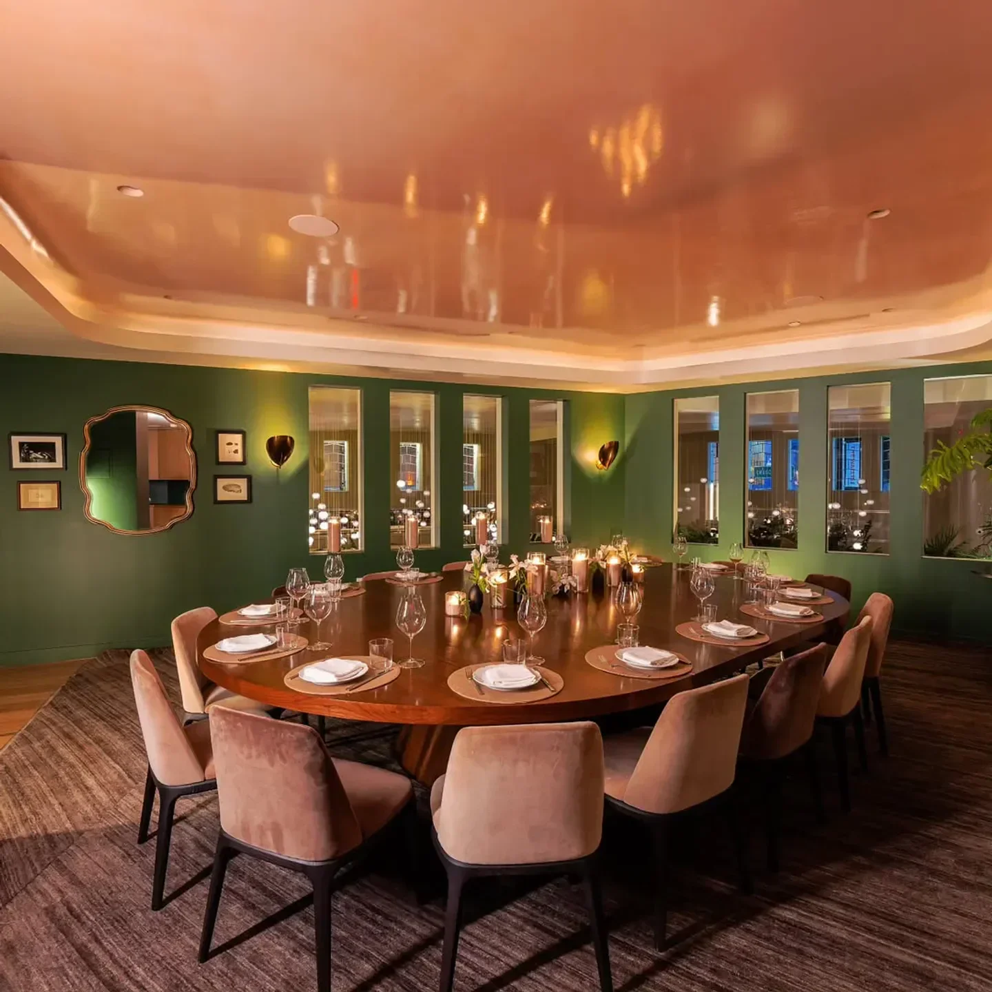 Elegant dining room at Funke Los Angeles, featuring a large wooden table and stylish chairs.