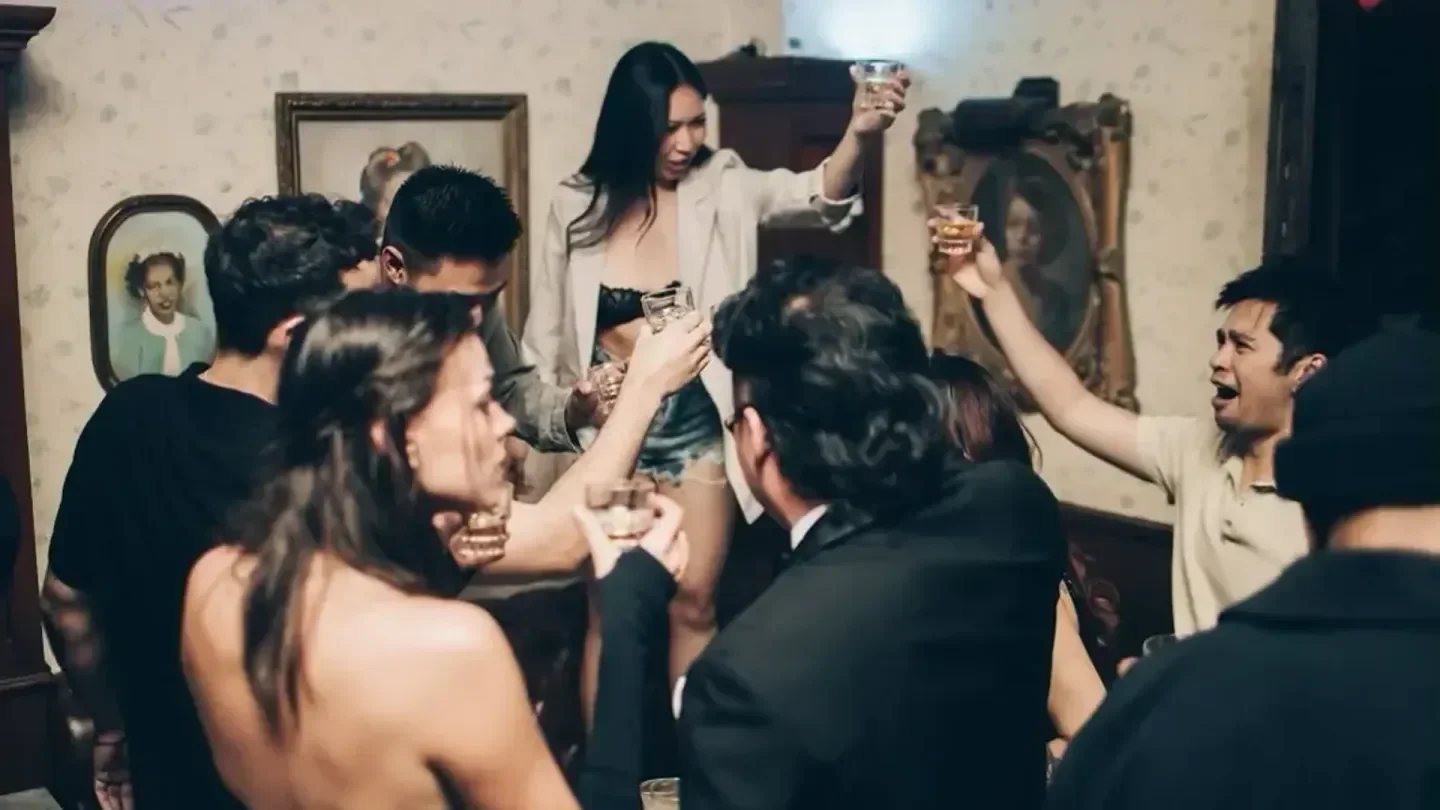 Group toasting drinks at Harlowe nightclub in Los Angeles, festive celebration.