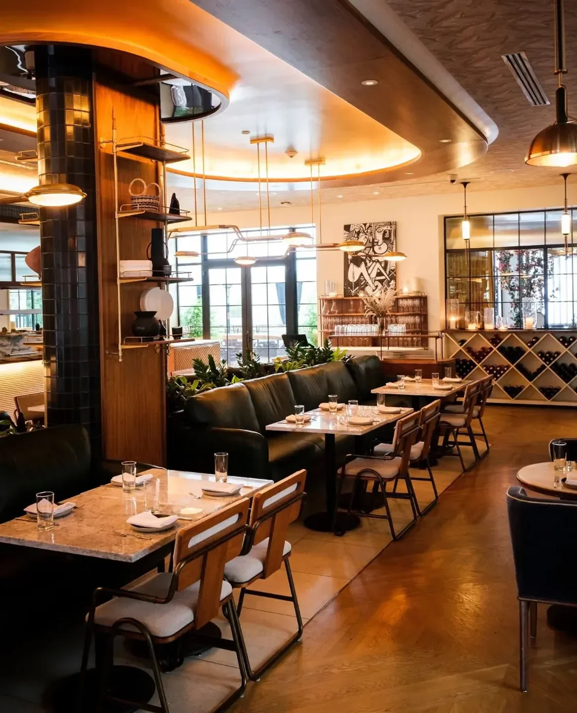 Interior of Ladyhawk restaurant in Los Angeles with stylish tables and lighting