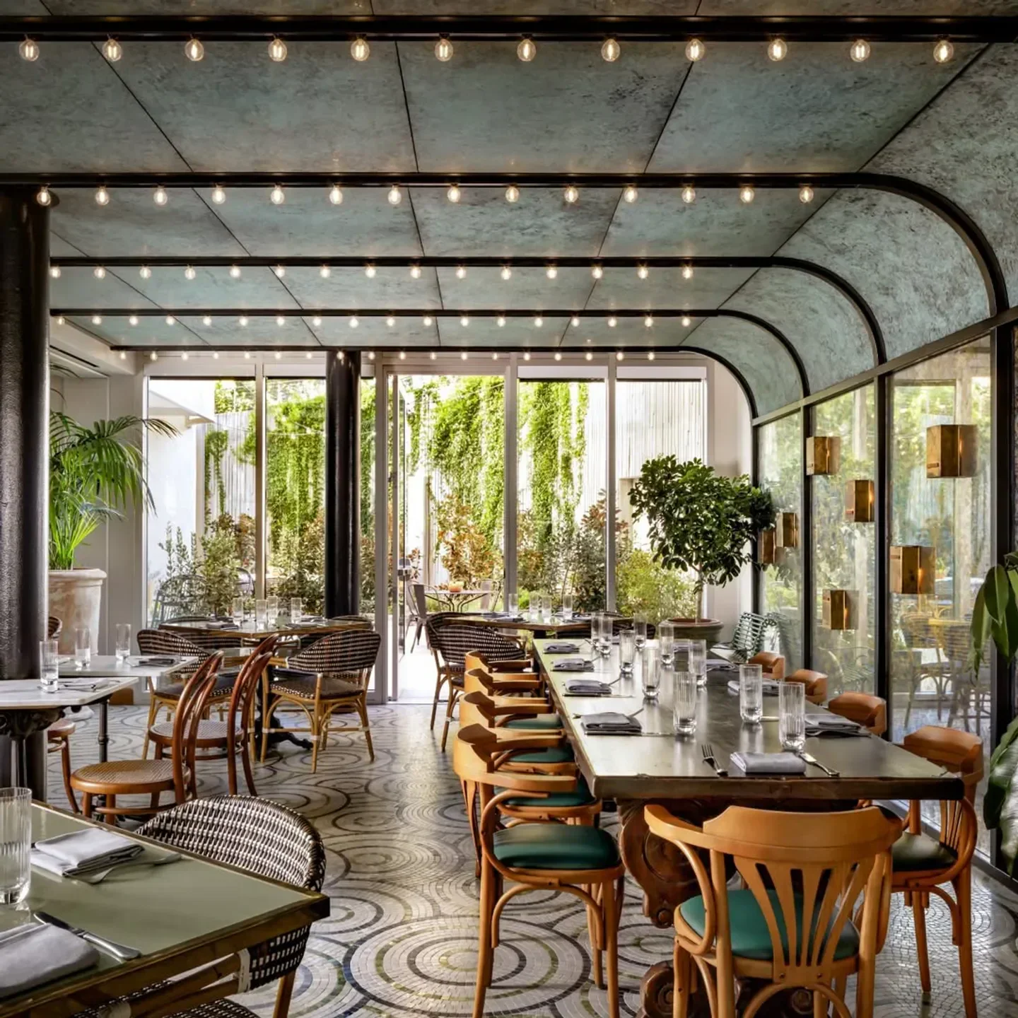 Elegant dining area at Lumière restaurant in Los Angeles, featuring stylish seating.