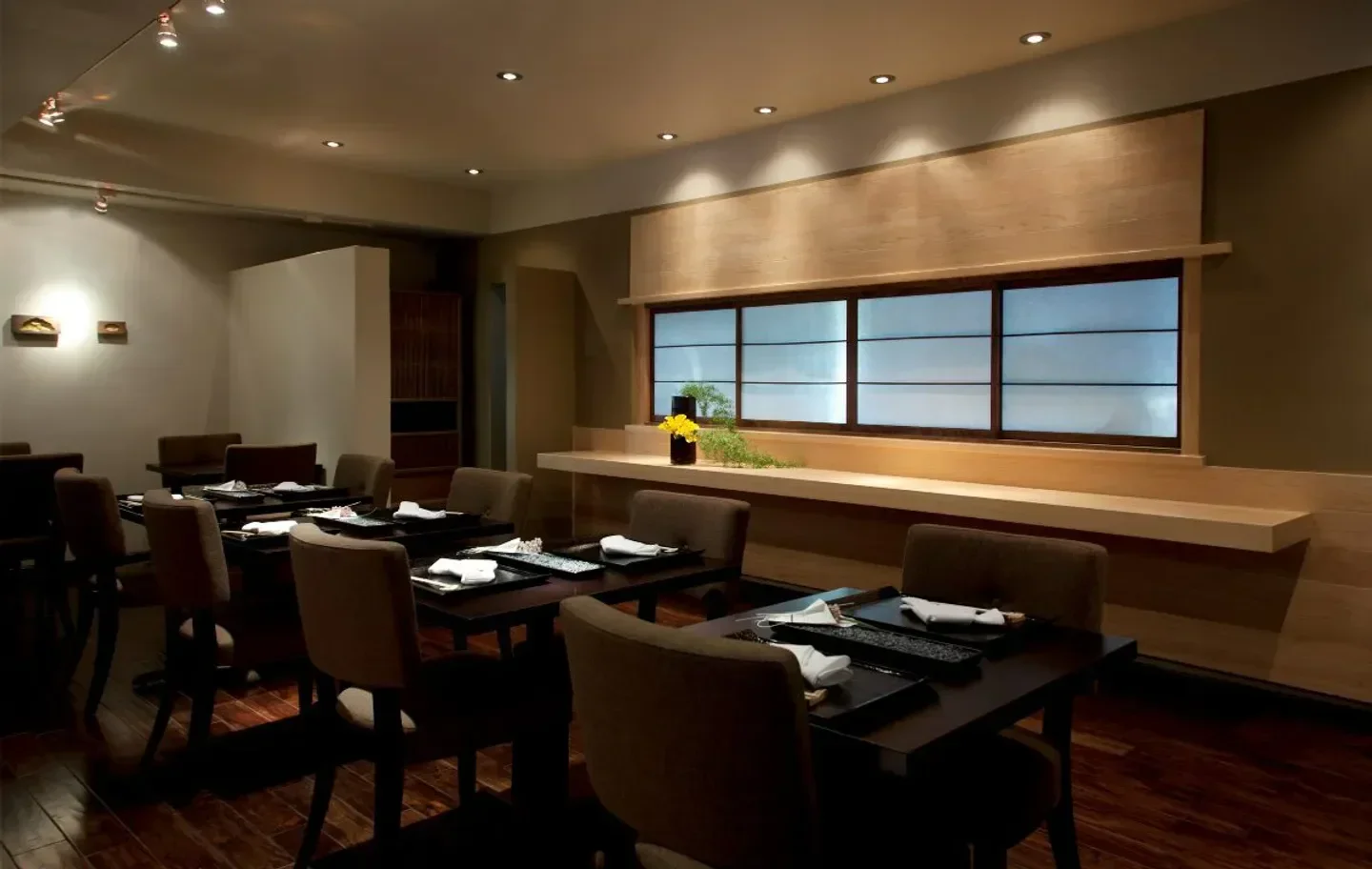 Interior of n/naka in Los Angeles, featuring elegant dining tables and ambiance.