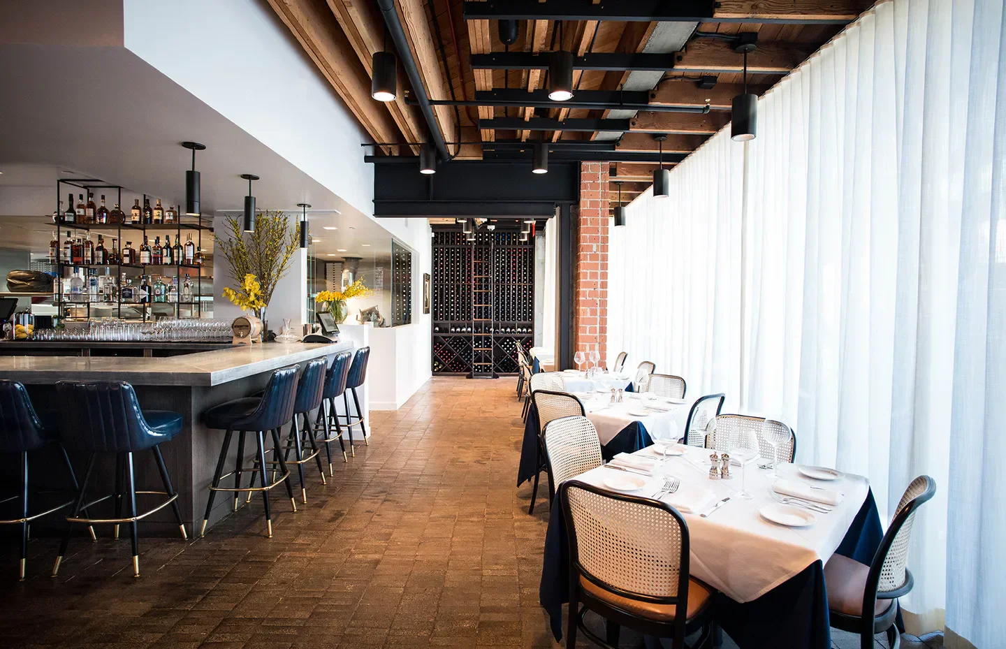 Interior of Nerano restaurant in Los Angeles with bar and dining area