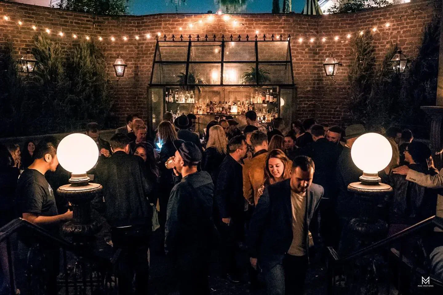 Nightclub scene at No Vacancy in Los Angeles, brick wall and crowds of people