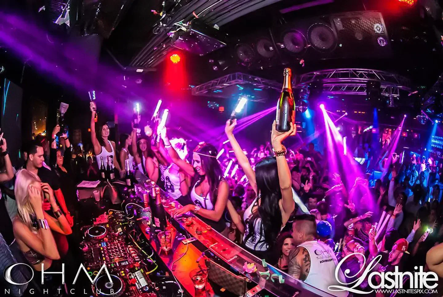 Energetic party scene at OHM Nightclub in Los Angeles with bottle service and dancing