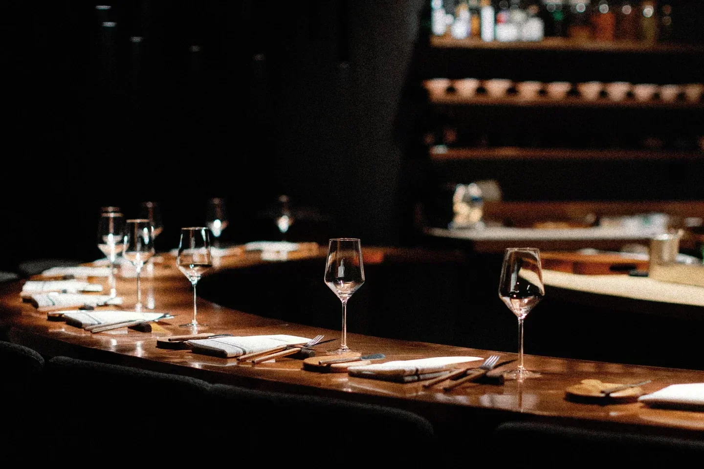 Pasta Bar in Los Angeles: Interior with wine glasses set for an elegant dining experience.