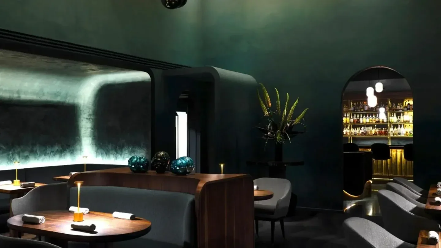 Providence restaurant in Los Angeles interior, featuring a moody bar and dining area.