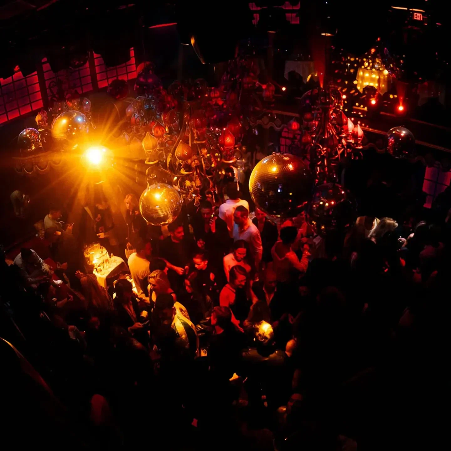 Raspoutine Los Angeles nightclub interior, with a crowd dancing under the disco balls.