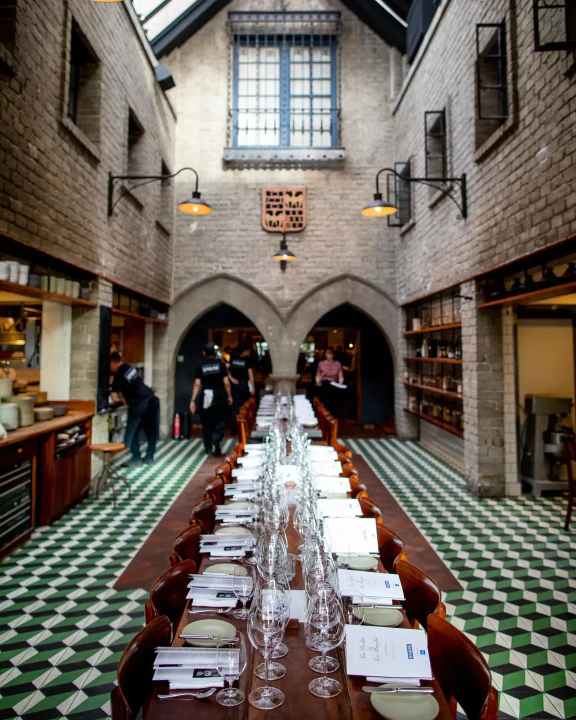 Long dining table at République Restaurant in Los Angeles, elegant setting.