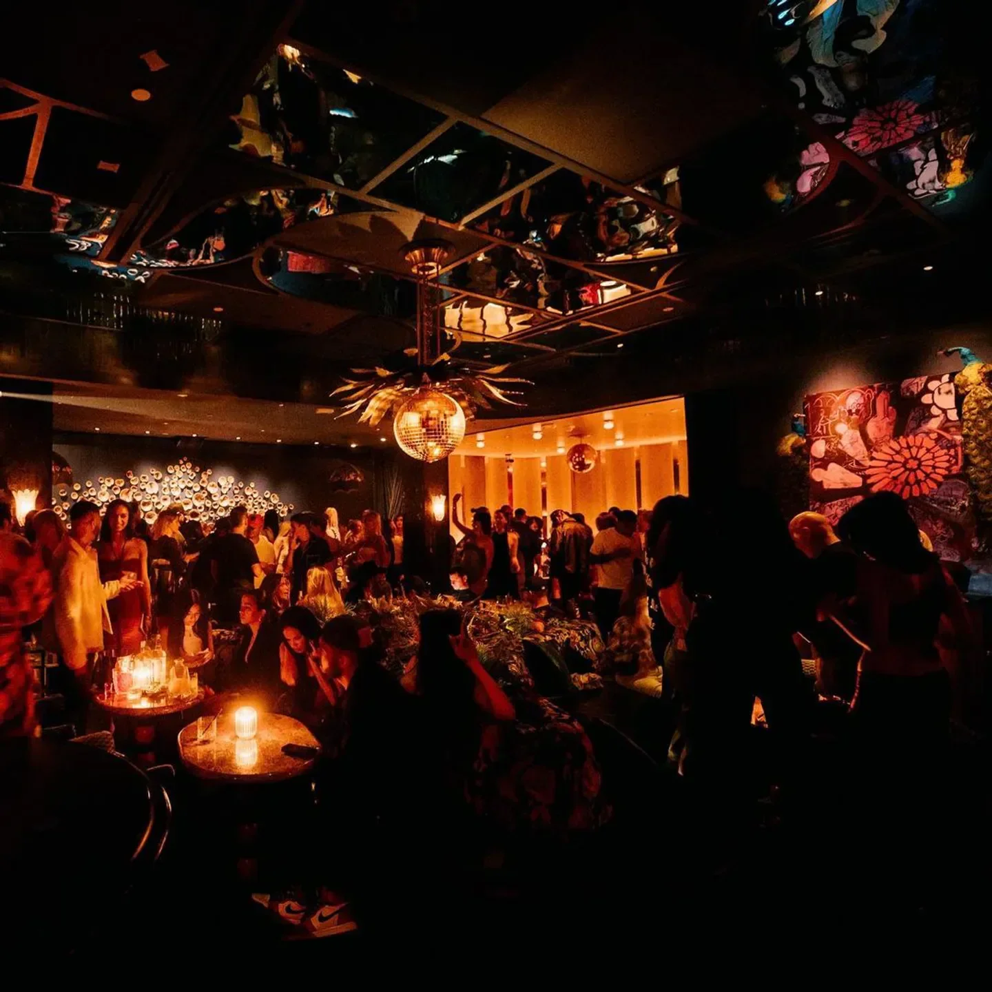 The Fleur Room in Los Angeles: a bustling, dimly lit scene with a disco ball