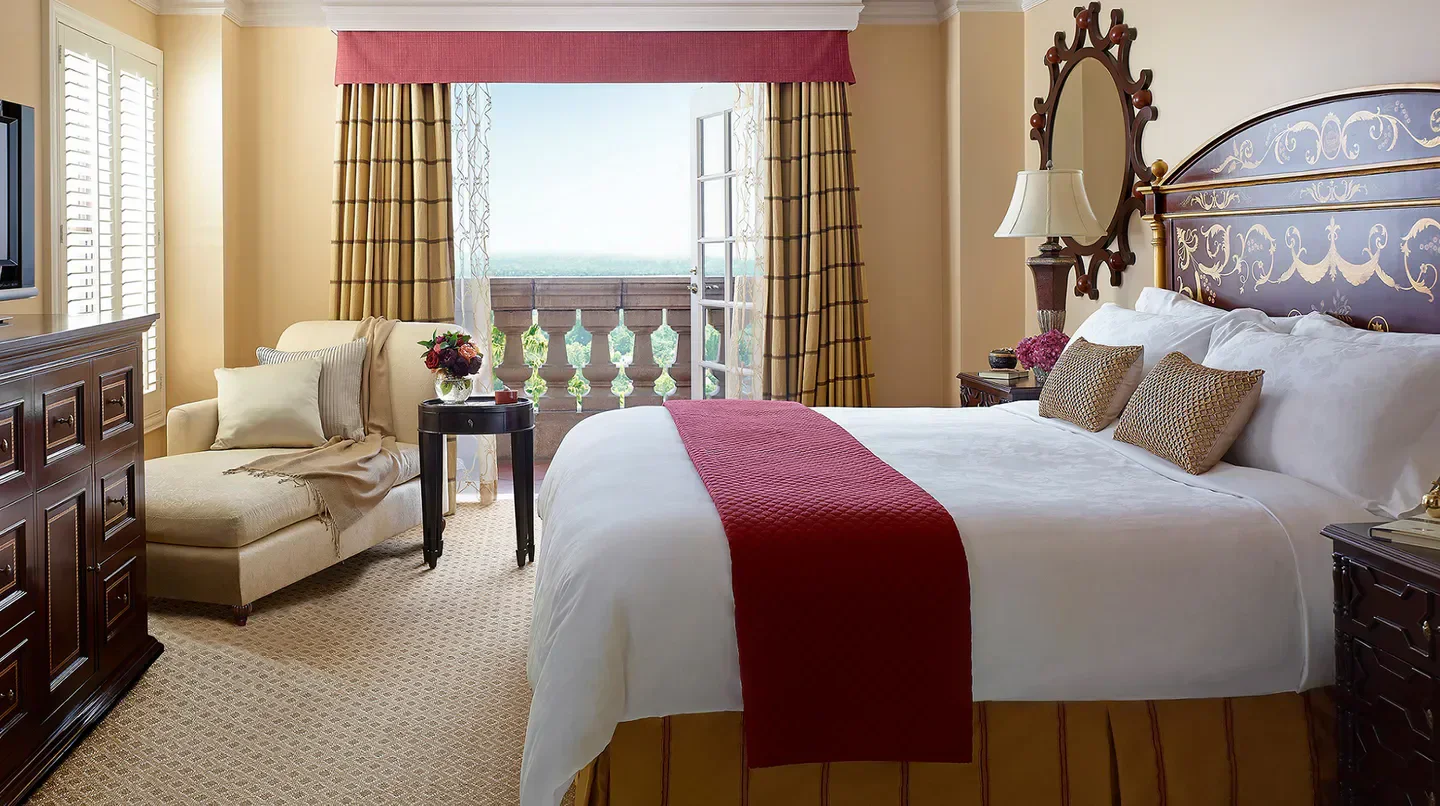 Elegant bedroom at The Langham Huntington, Pasadena, with balcony view in Los Angeles.