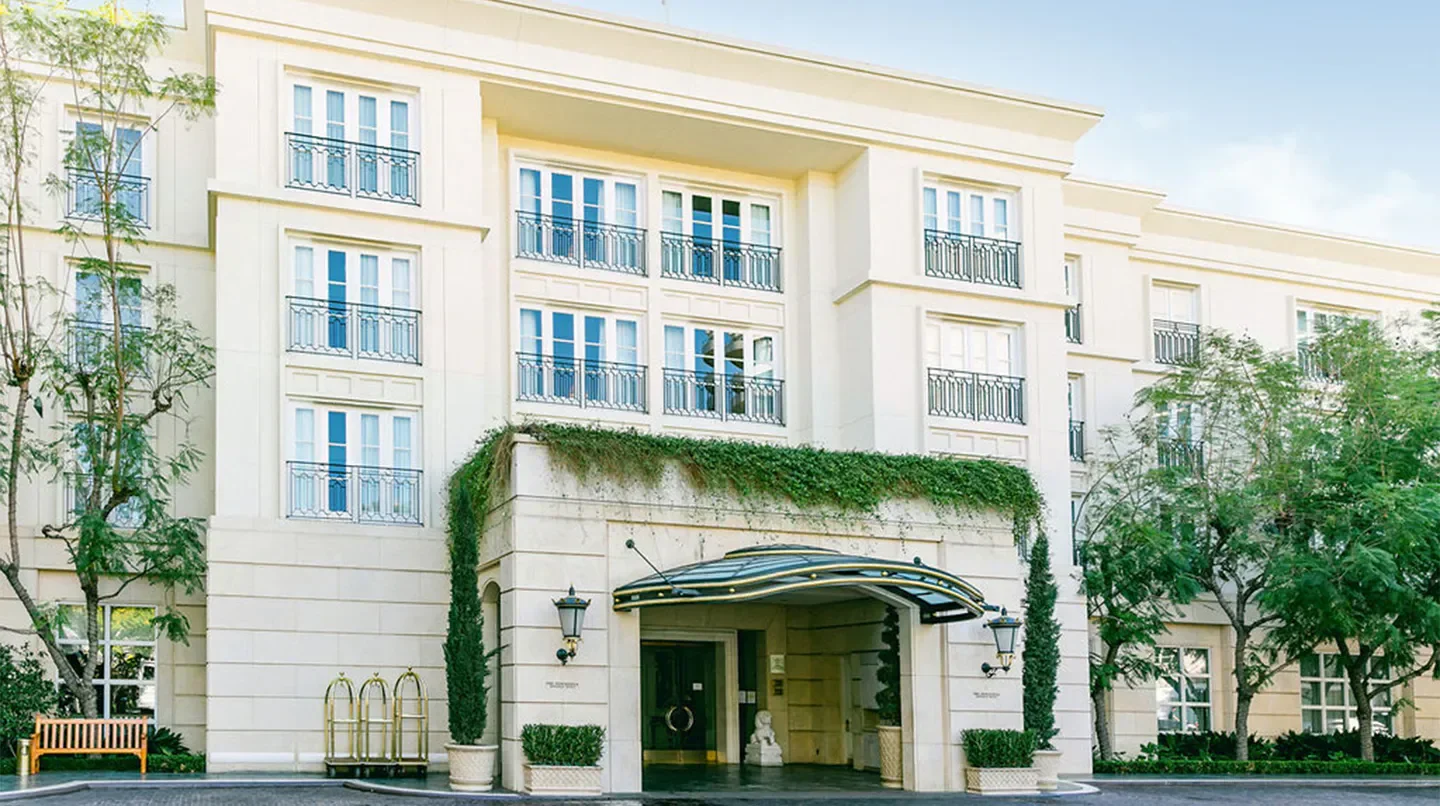 Exterior of The Peninsula Beverly Hills hotel in Los Angeles, California, with entrance canopy.