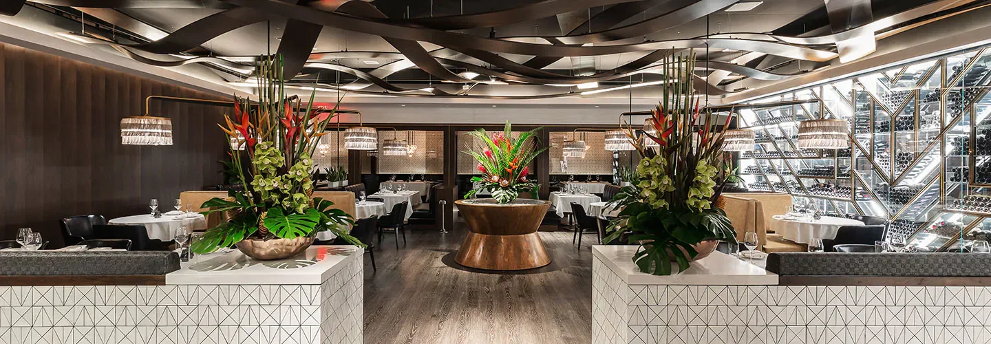 Elegant dining room interior at The Pines Modern Steakhouse in Los Angeles.